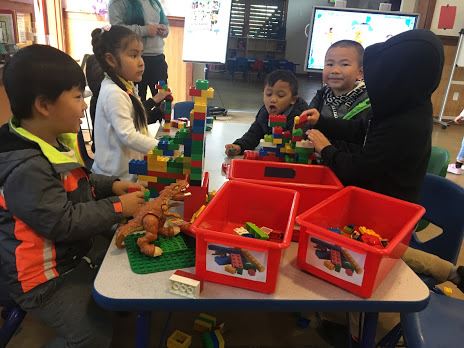 Kiddie Korner Participants playing with Legos