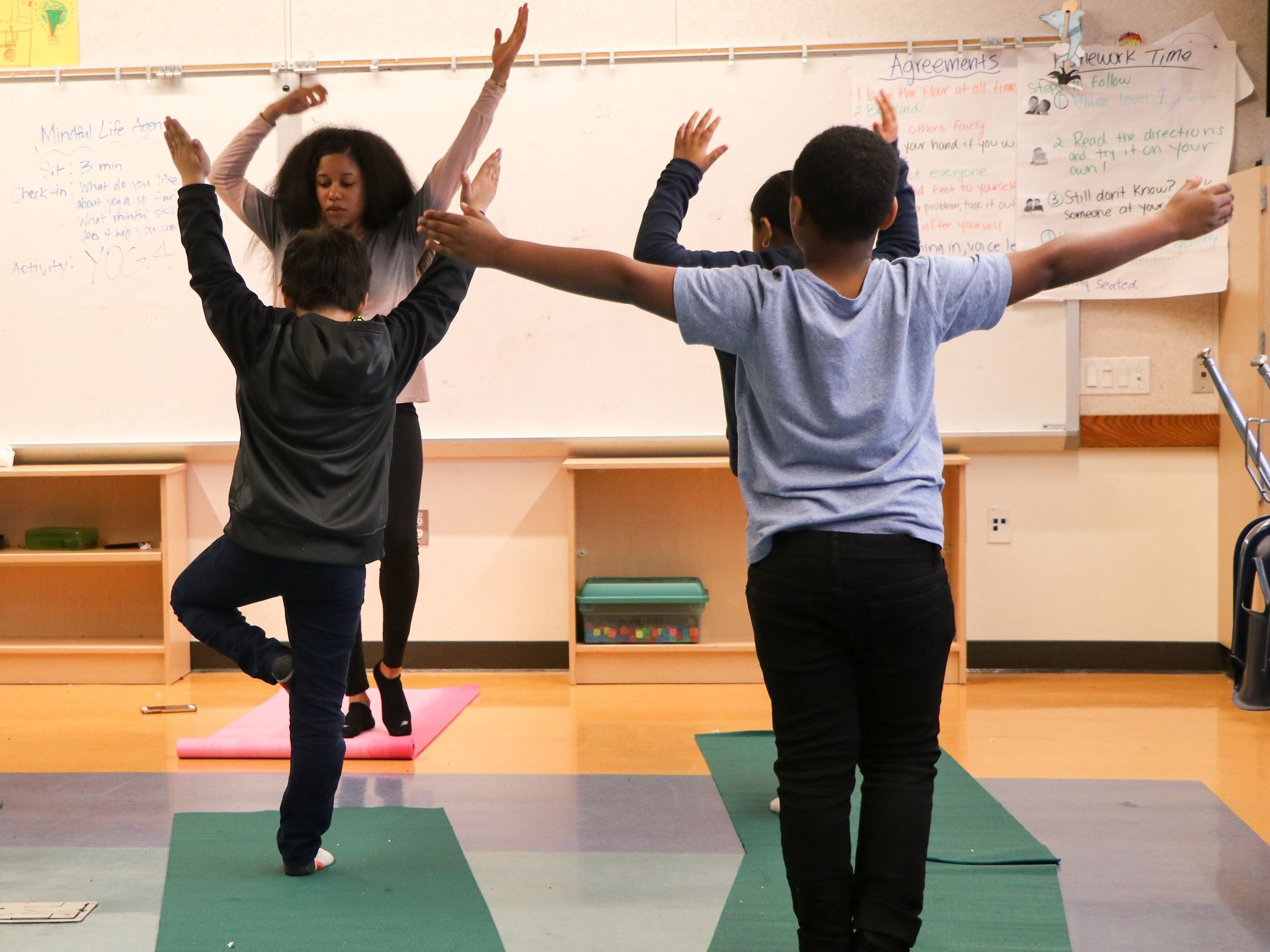 Students Practicing Yoga Poses in Mindful Life Group